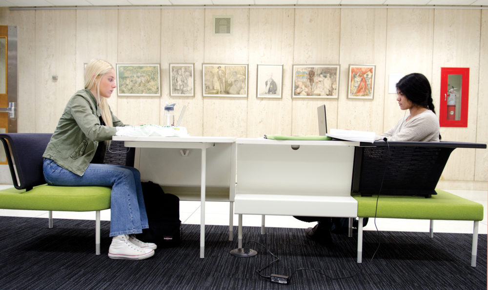 Two students studying for finals in Wilson Library.