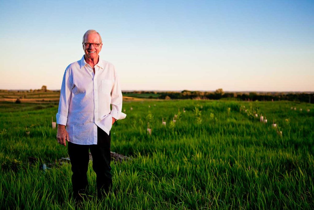 Dewey Thorbeck standing in a field