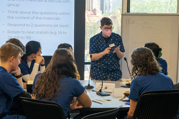 Ai Miller leads a discussion about DEIA within dentistry to a group of first year dental students