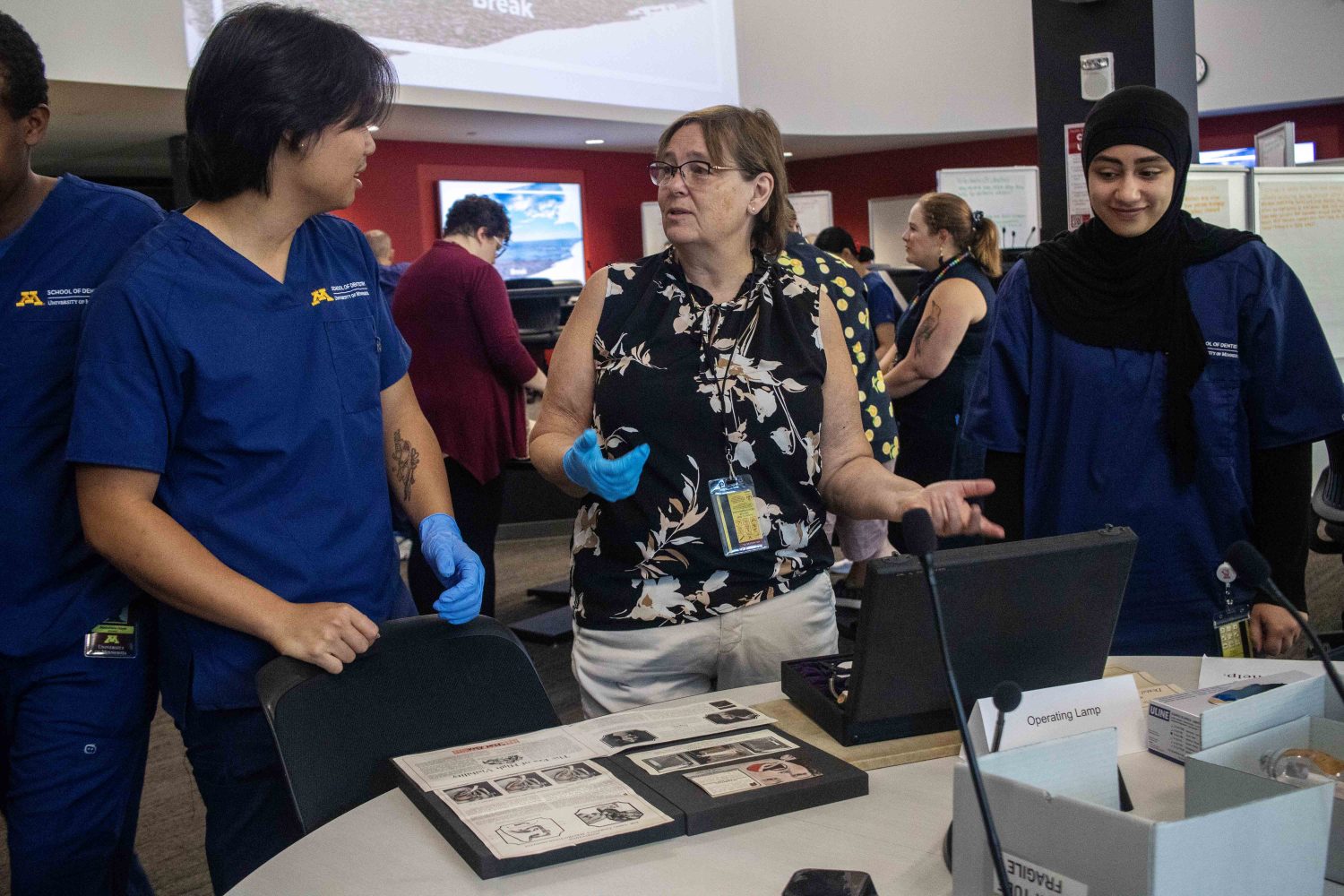 Facilitators show off artifacts and rare materials on Aug. 16, 2023. (Photo/Adria Carpenter)