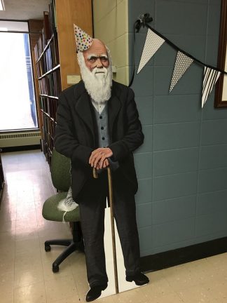 Cutout of Charles Darwin celebrating his birthday