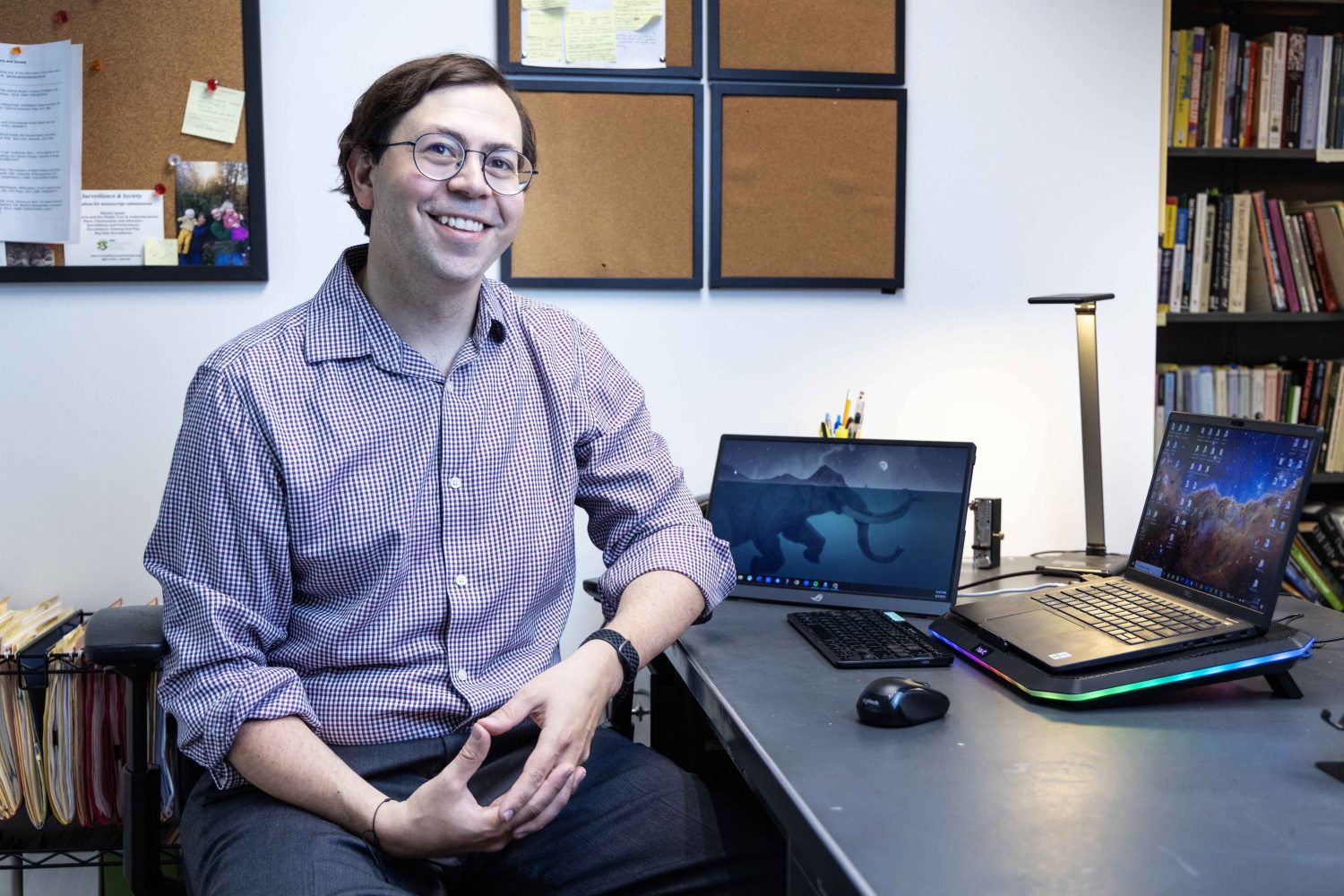 Atilla Hallsby, associate professor in the communication studies department at the University of Minnesota, poses for a portrait on Thursday, Aug. 3, 2023. Hallsby is author of the open-access textbook, "Reading Rhetorical Theory," published with the help of the UMN Libraries' Partnership for Affordable Learning Materials. (Photo/Adria Carpenter)