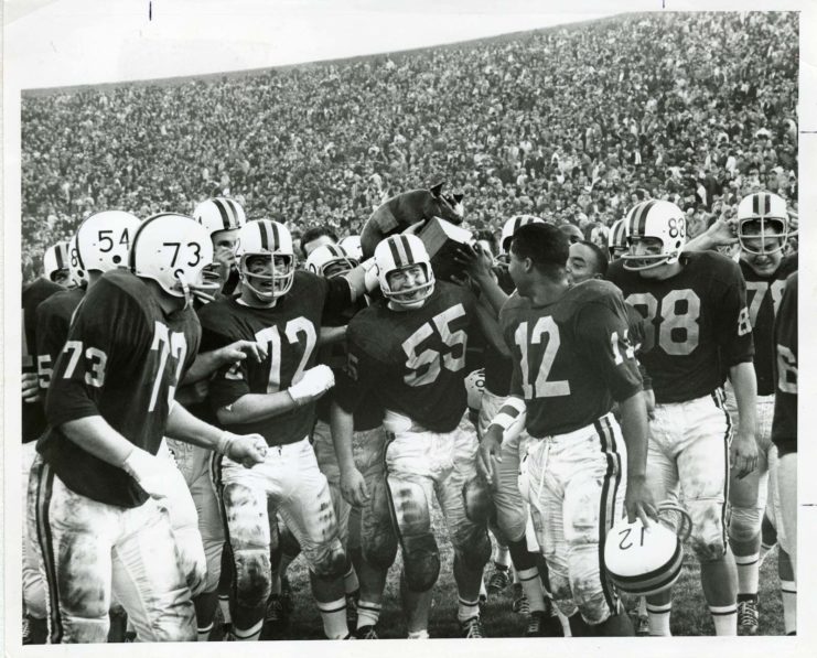 Golden Gophers celebrating a victory against Iowa (and hoisting the Floyd of Rosedale trophy), available at http://brickhouse.lib.umn.edu/items/show/92.