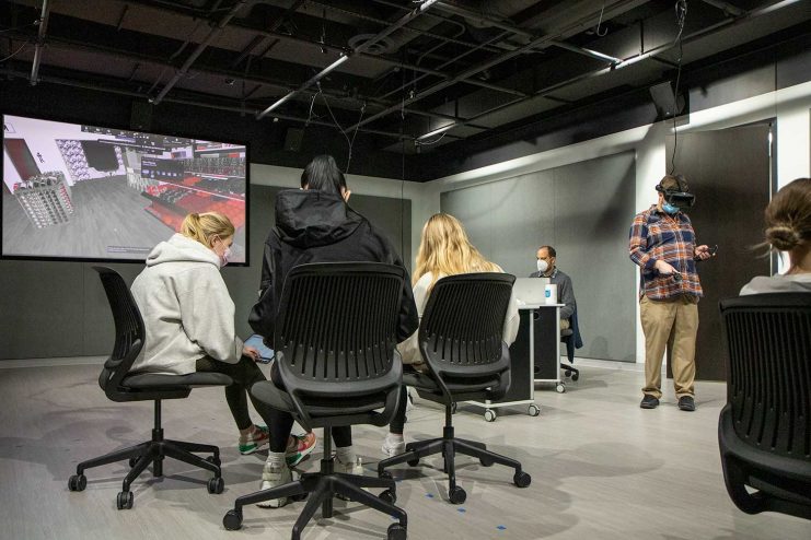 Charlie Heinz and three design students in the VR Studio.
