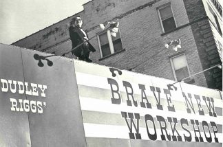 Dudley Riggs atop his Brave New Workshop