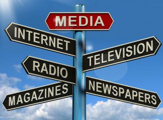 Sign post featuring various media formats, for example Magazines, Newspapers, Television, Internet.