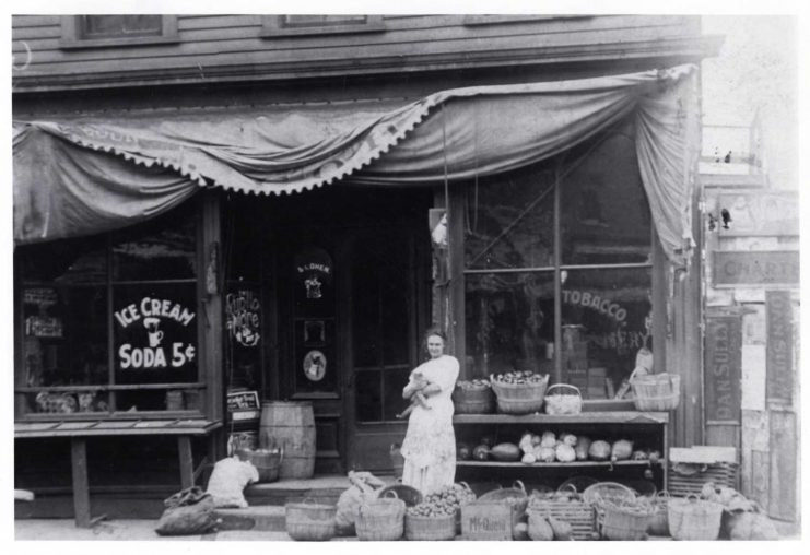 Fanny Cohen in front of the family grocery store, St. Paul, Minnesota