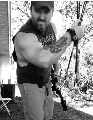 Jason Herbert with his turtle tattoo.