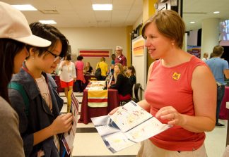 At orientation, Undergraduate Services Librarian Kate Peterson talks with incoming students about the value of the Libraries.
