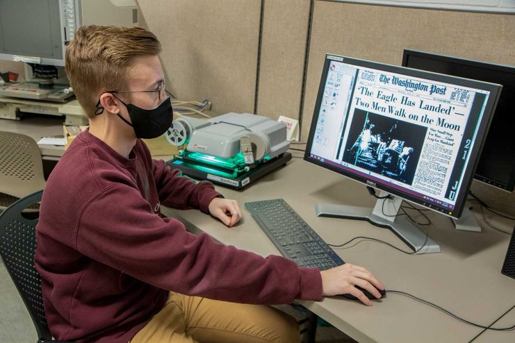 Student using microfilm