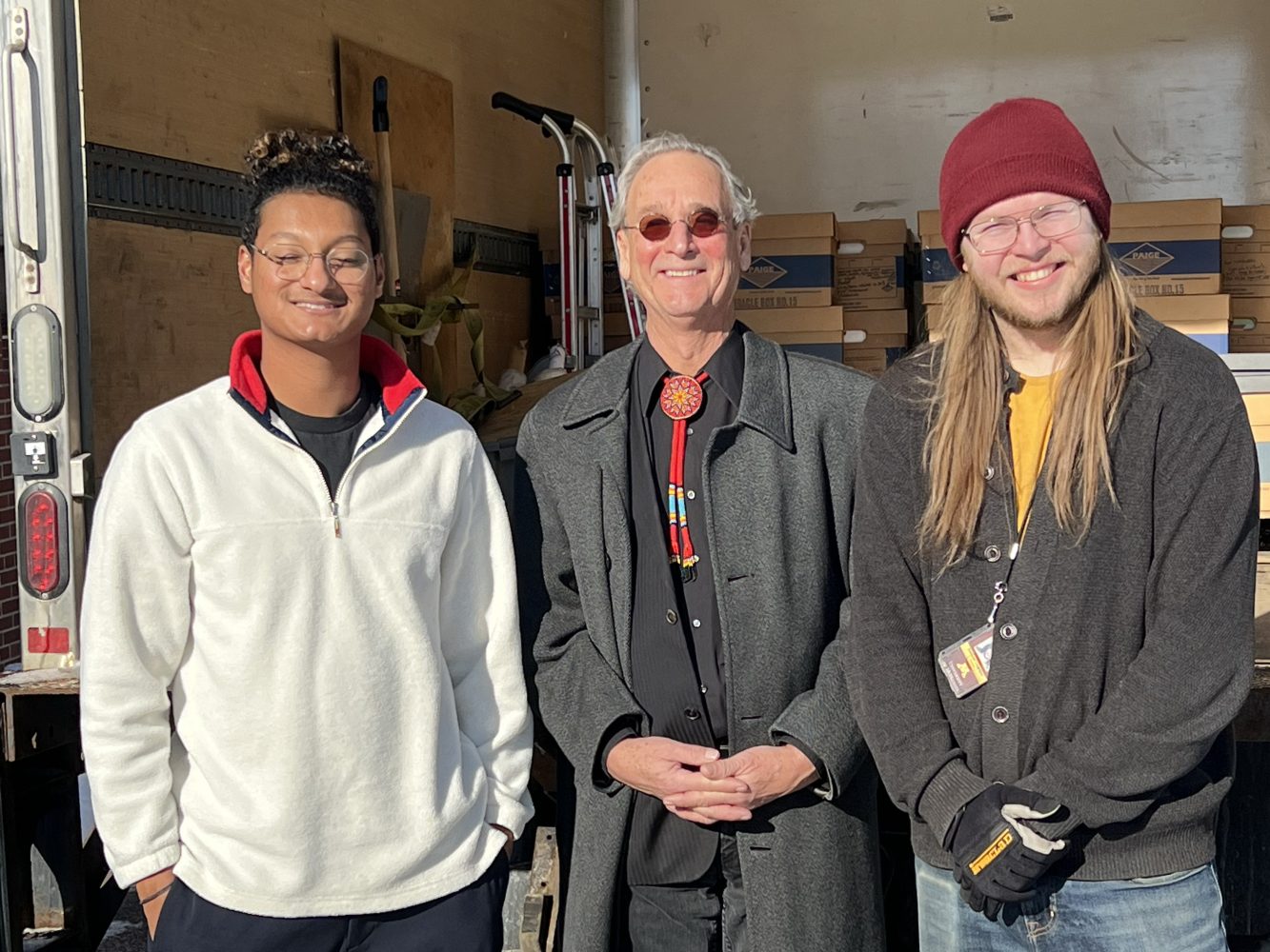 Performance artist Larry Long with two U of M Libraries staff members