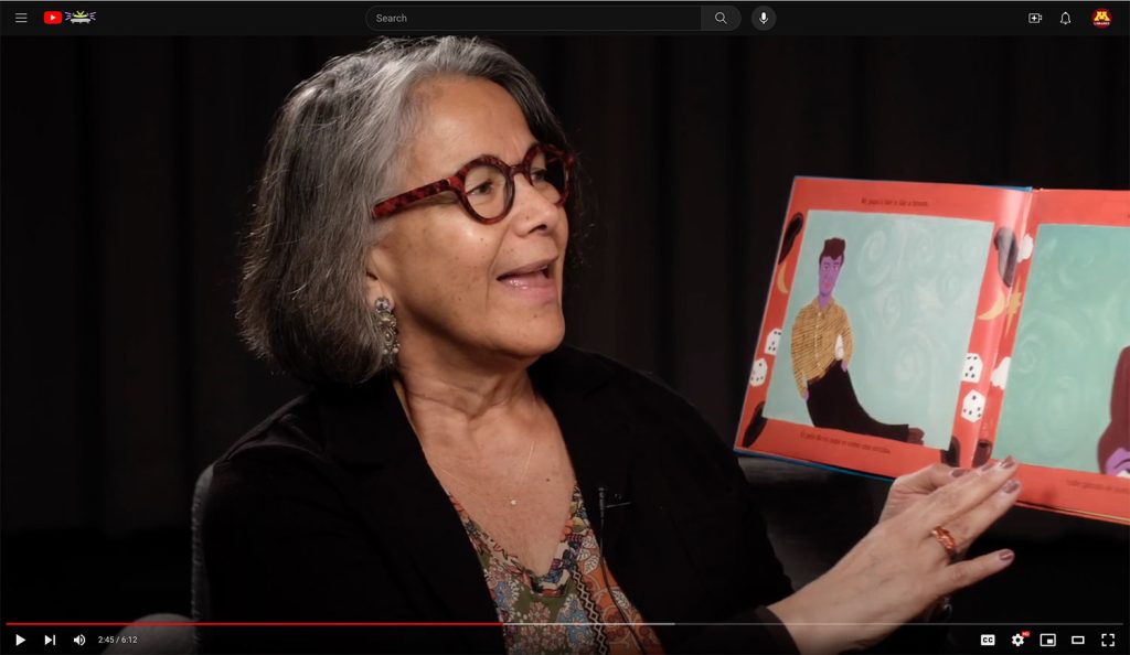 Patricia Izek reading a children's book.