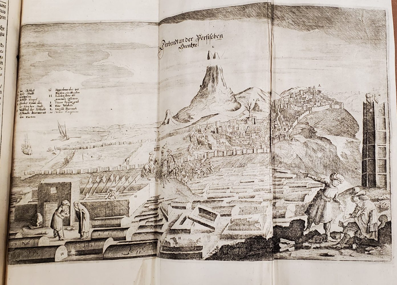 Landscape tableau with Olearius taking notes in the foreground; mountain and walled city in the background.