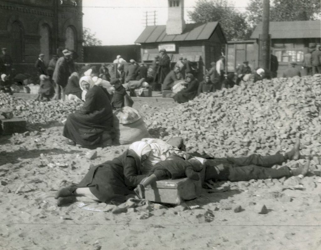 "I was arrested for taking this railway scene. Starved peasants wait weeklong for trains to some objective they vainly imagine is the Promised Land where they may find enough food to keep alive," wrote photographer James Abbe. Image reproduced courtesy of The James Abbe Archive.