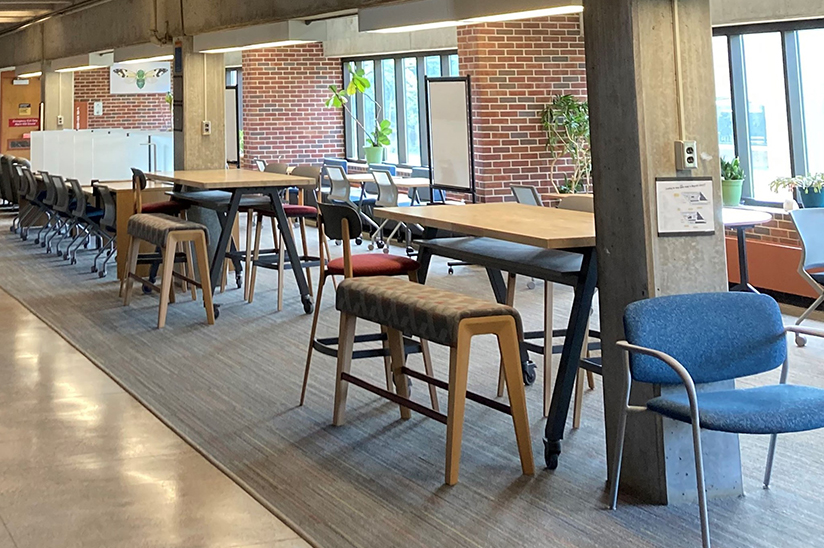 Basement of Magrath Library featuring open study space with natural light