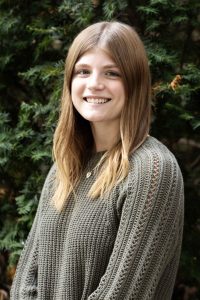 Abby Zumbrunnen, a peer research consultant, poses for a portrait outside Walter Library on Friday, Sept. 22, 2023. (Photo/Adria Carpenter)