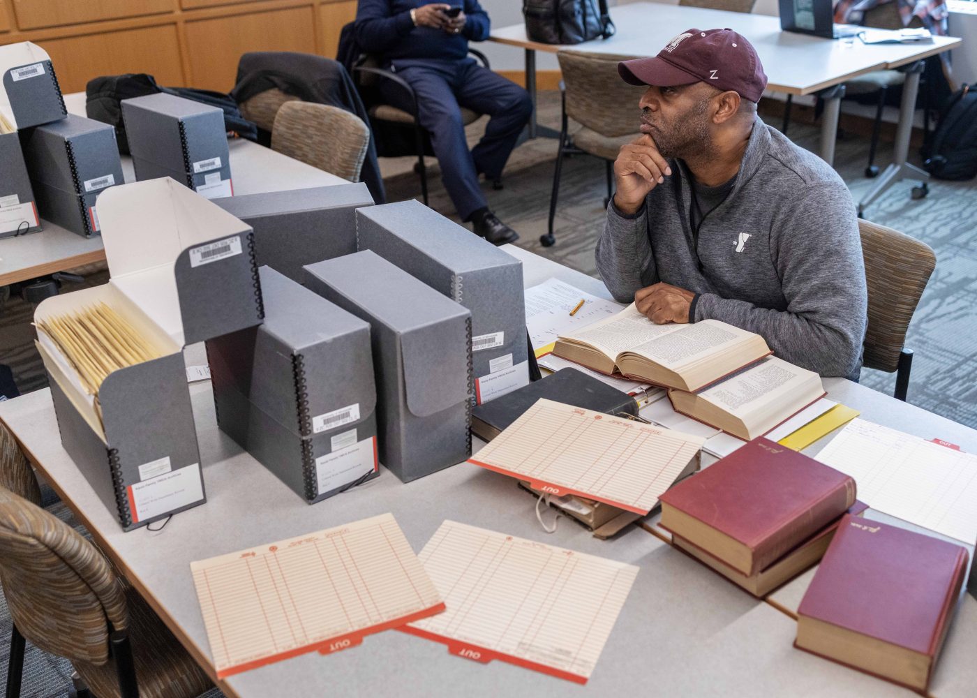 Michael Levesque, executive director of Morehouse College’s National Alumni Association, scans through folders from the Kautz Family YMCA Archives, on Wednesday, April 17, 2024. (Photo/Adria Carpenter)