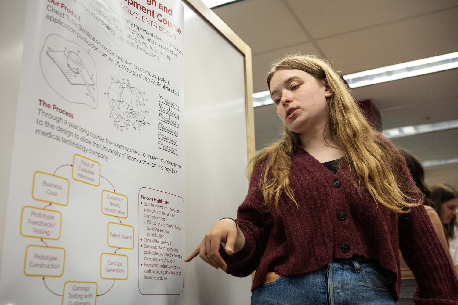New UMN Medical Technology discusses a chest tube stabilzation device during the Student Showcase for Founder's Day at Walter Library on Wednesday, May 8, 2024. (Photo/Adria Carpenter)