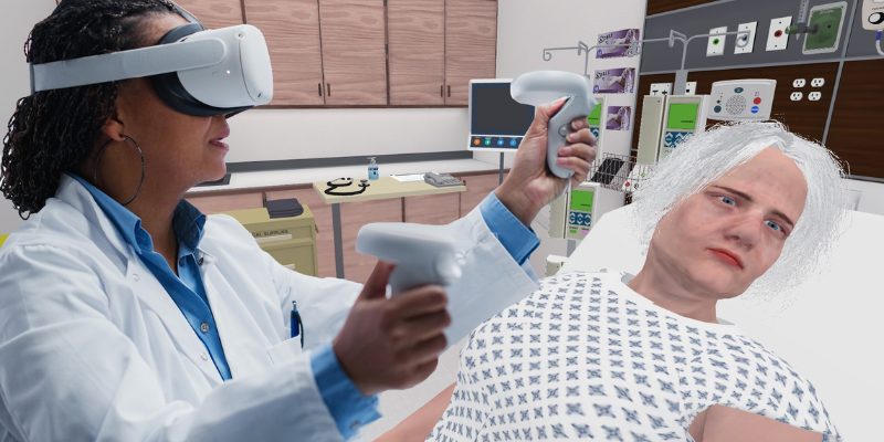 Person with VR headset and handsets providing simulated patient care in a virtual hospital setting.