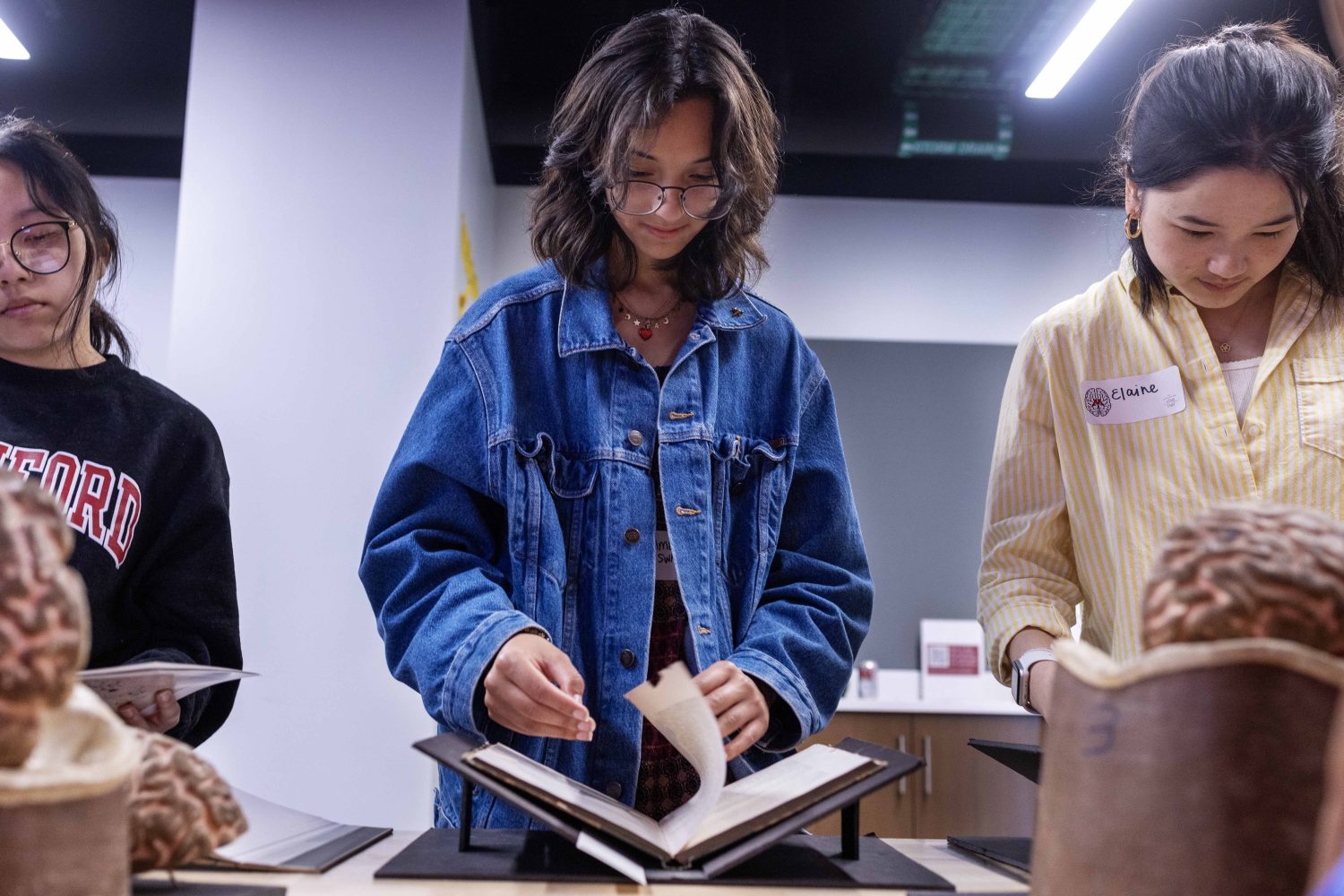 Local Twin City high schoolers interested in neuroscience look at materials from the Wangensteen Historical Library during the week-long Go4Brains program, on Wednesday, July 17, 2024. (Photo/Adria Carpenter)