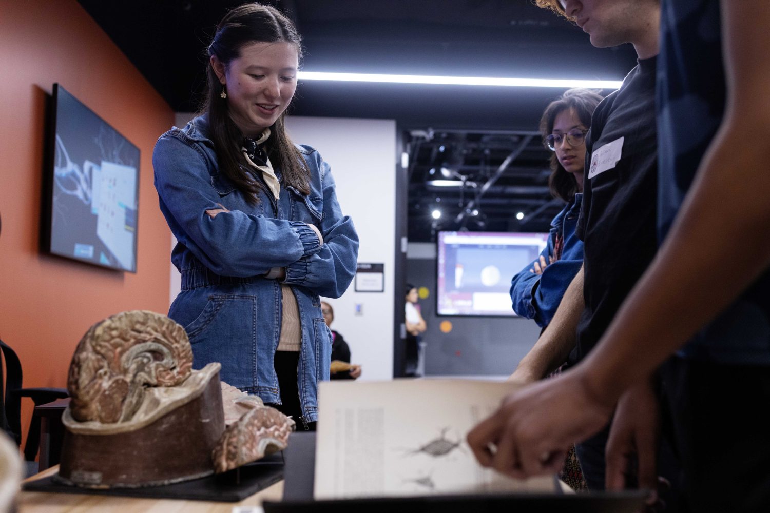 Local Twin City high schoolers interested in neuroscience look at materials from the Wangensteen Historical Library during the week-long Go4Brains program, on Wednesday, July 17, 2024. (Photo/Adria Carpenter)