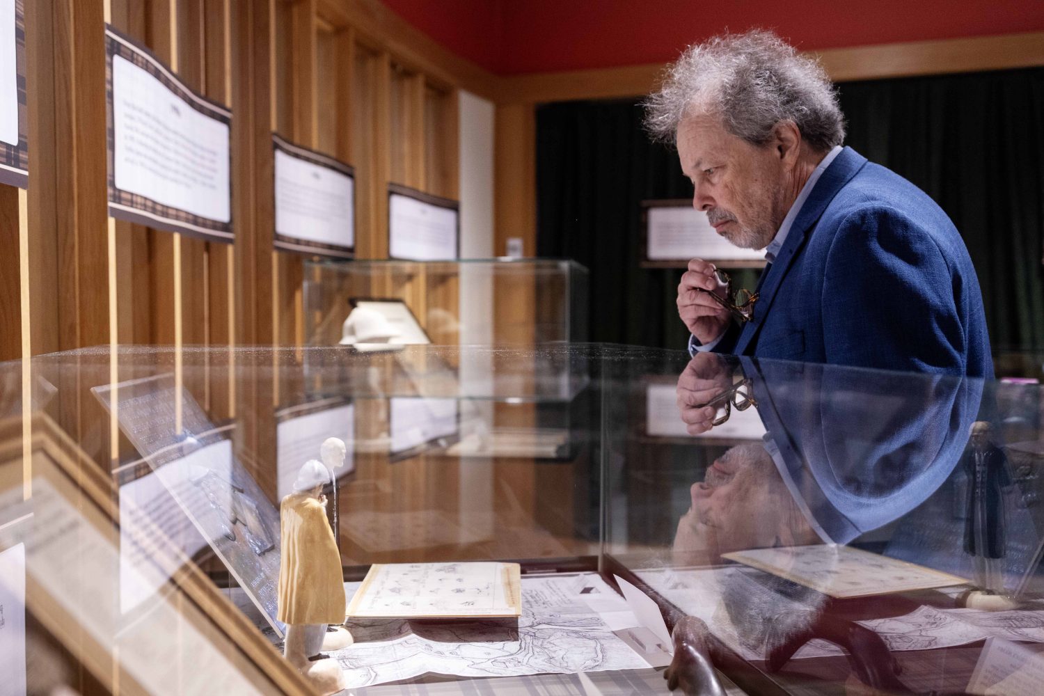 An attendee looks at materials in the "Sherlock Holmes at 50" exhibit at Elmer L. Andersen Library on Friday, July 26, 2024. (Photo/Adria Carpenter)