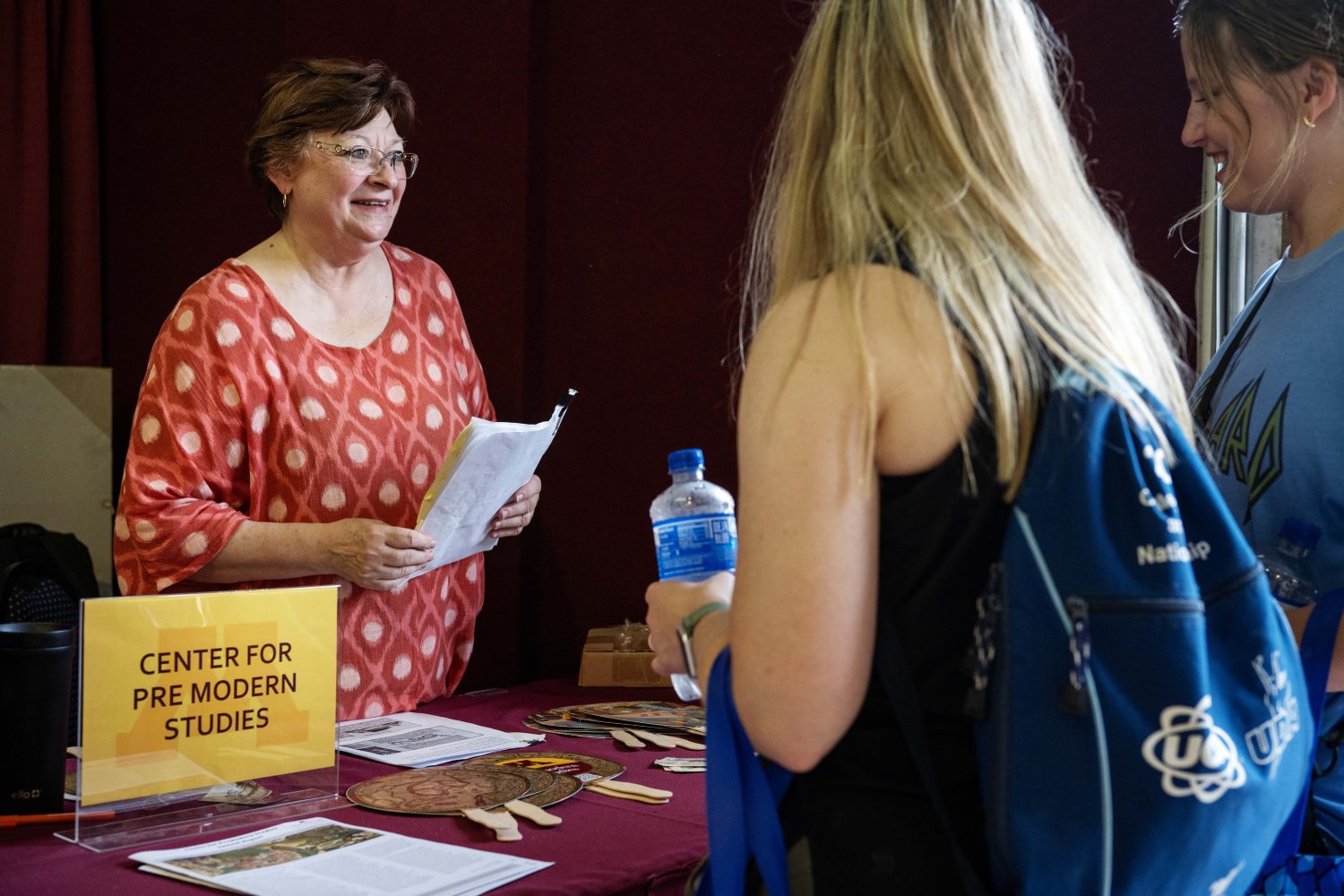 Marguerite Ragnow, curator of the James Ford Bell Library, asks trivia questions at the Center for Premodern Studies' booth at the Minnesota State Fair on Thursday, August 29, 2024. (Photo/Adria Carpenter)