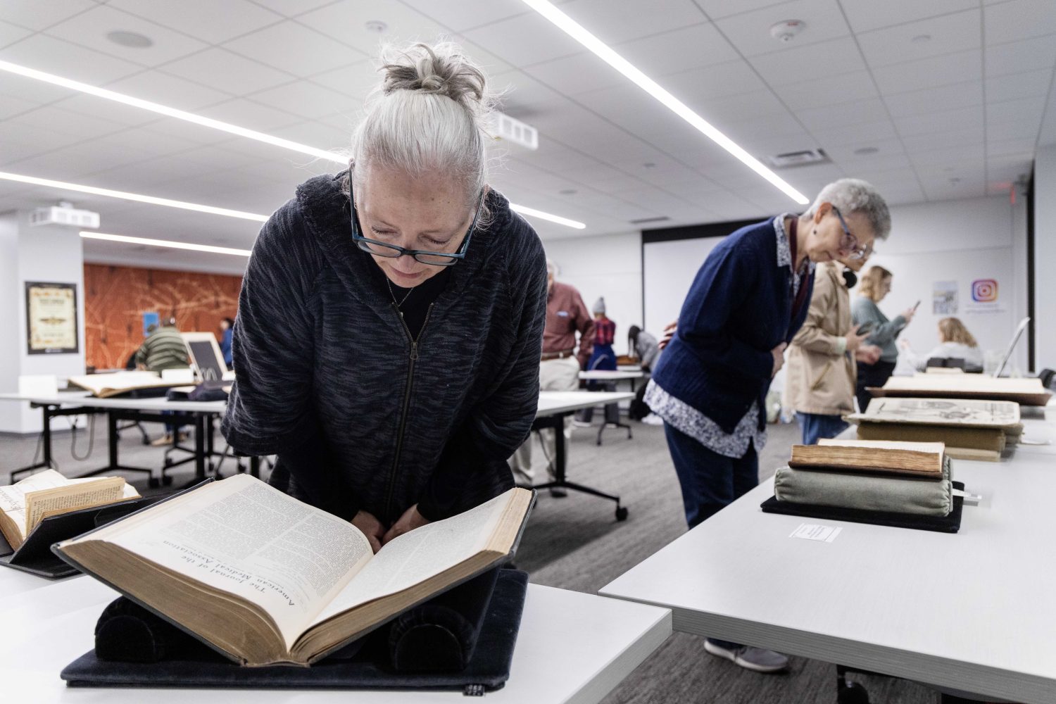 Attendees examine materials from the Wangensteen Historical Library's exhibit "Disembodied Reembodied," on Thursday, October 24, 2024. (Photo/Adria Carpenter)