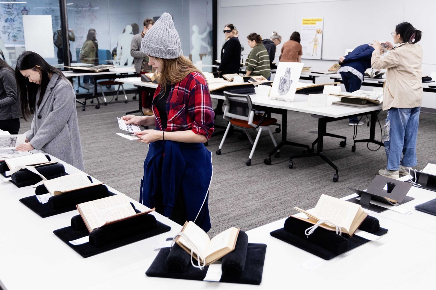 Attendees examine materials from the Wangensteen Historical Library's exhibit "Disembodied Reembodied," on Thursday, October 24, 2024. (Photo/Adria Carpenter)