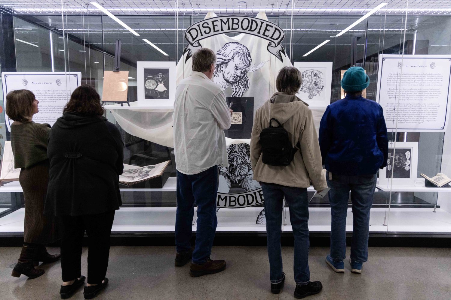 Attendees examine materials from the Wangensteen Historical Library's exhibit "Disembodied Reembodied," on Thursday, October 24, 2024. (Photo/Adria Carpenter)