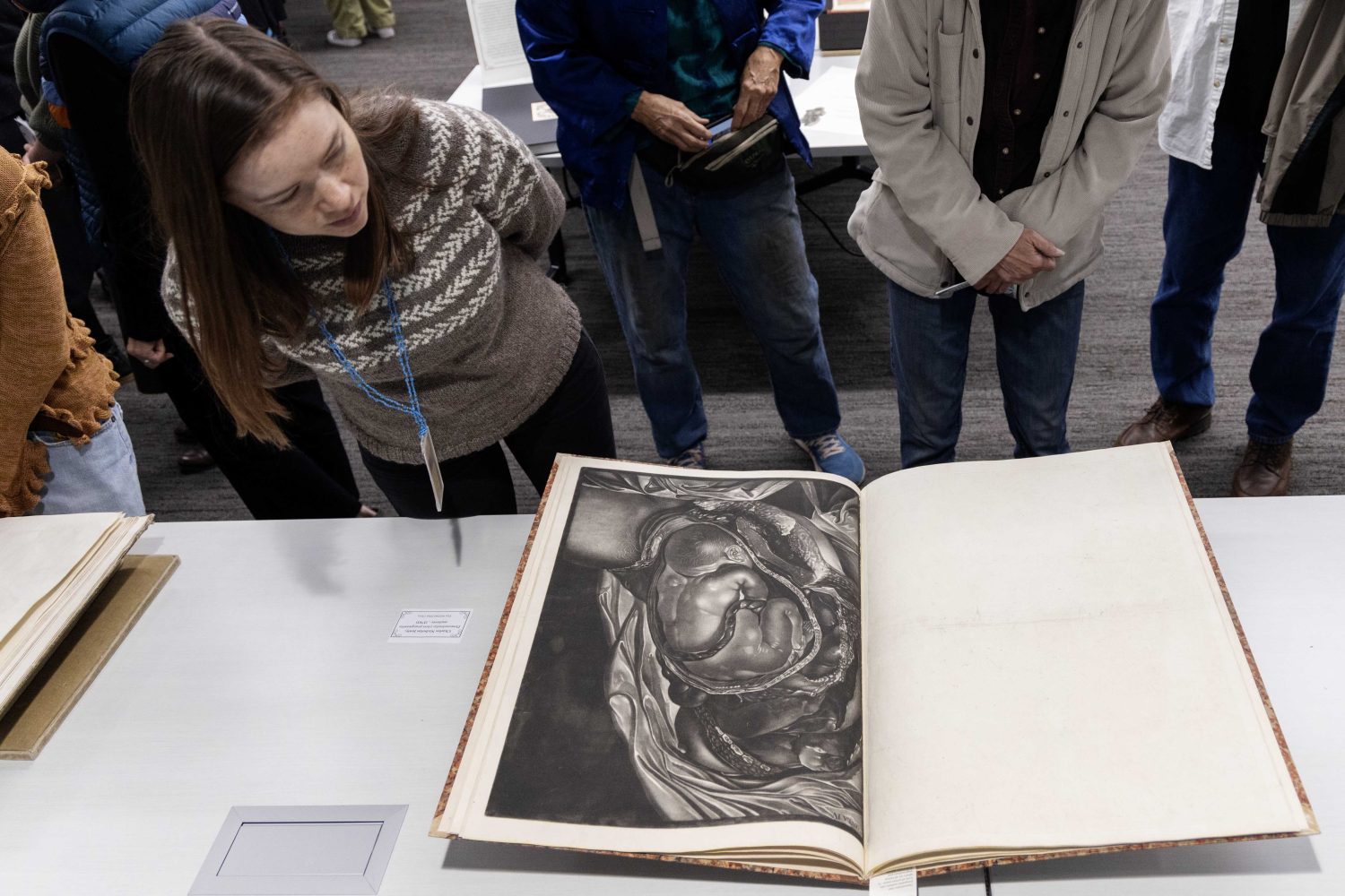 Attendees examine materials from the Wangensteen Historical Library's exhibit "Disembodied Reembodied," on Thursday, October 24, 2024. (Photo/Adria Carpenter)