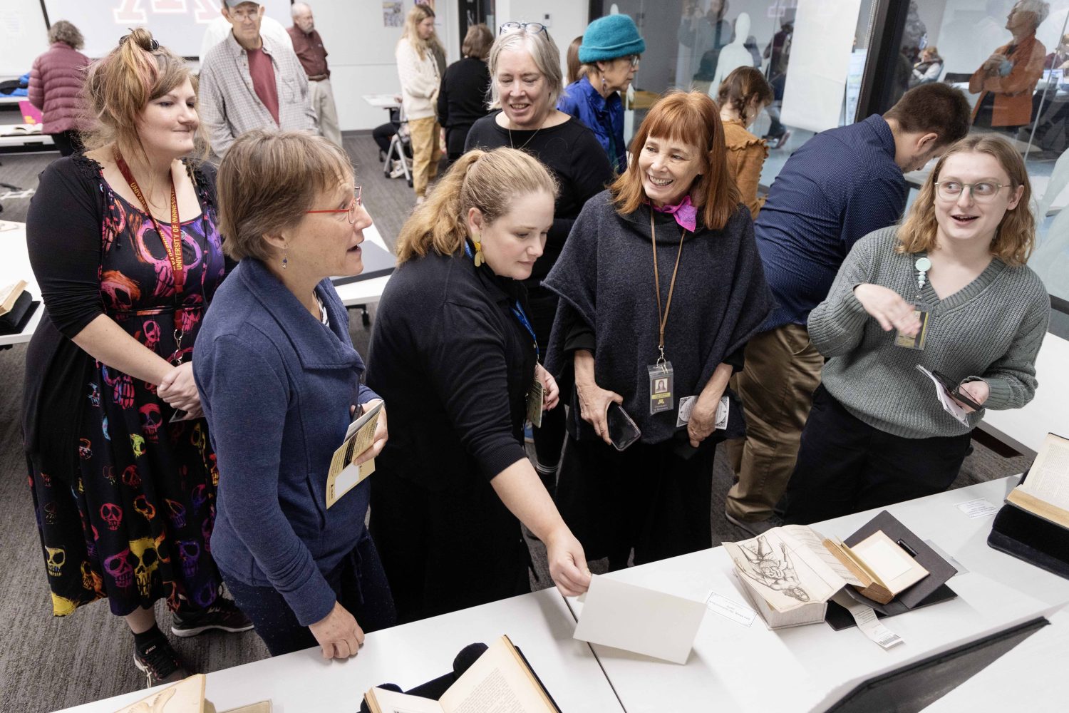 Emily Beck, curator of the Wangensteen Historical Library, speaks with guests at "Disembodied Reembodied" exhibit, on Thursday, October 24, 2024. (Photo/Adria Carpenter)