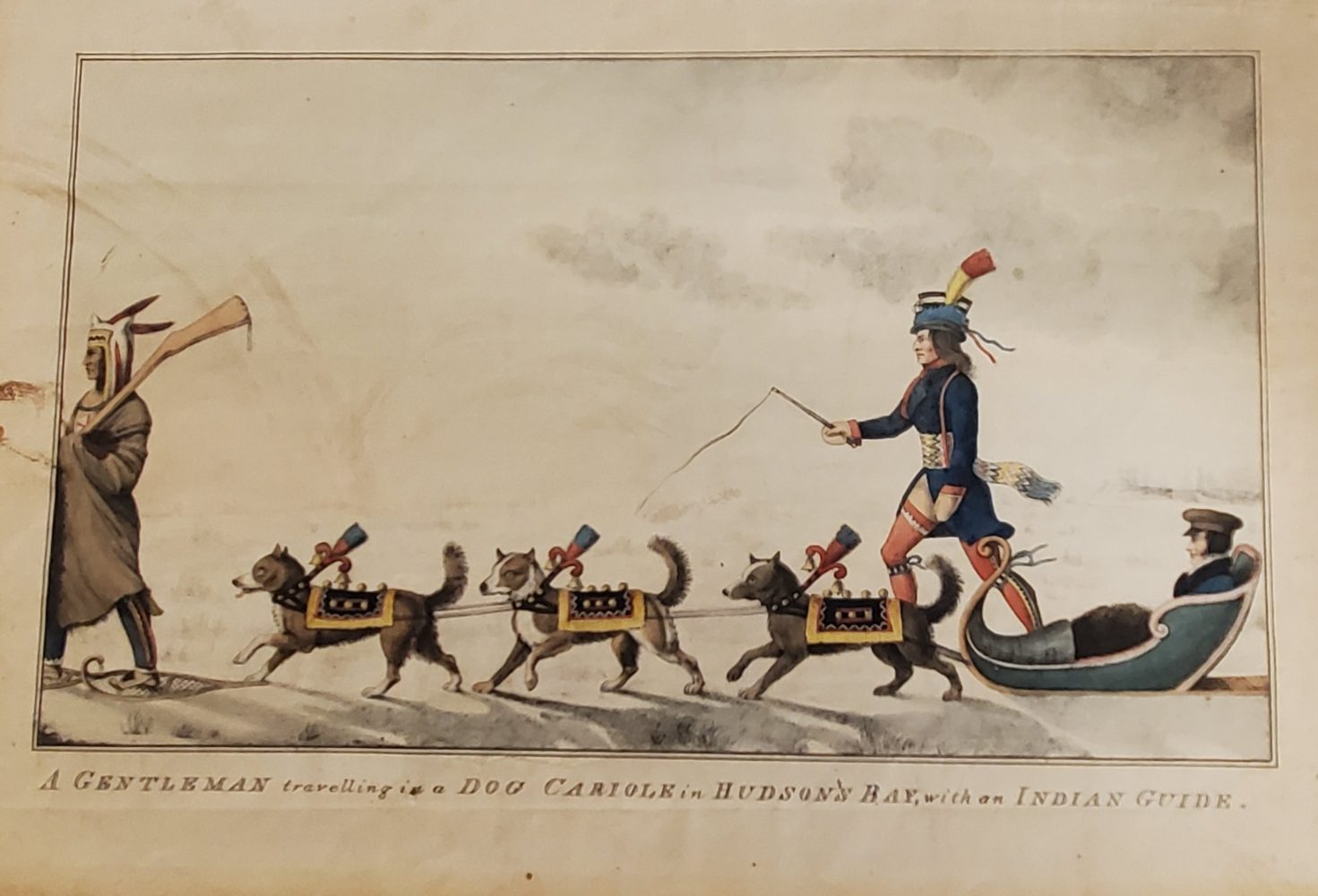 Image of European man sitting in sled pulled by dogs, led by a Native American man.