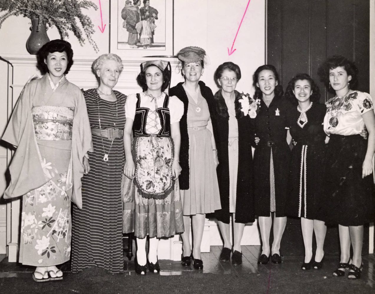 eight women standing in an office in 1946 in San Francisco International Institute.