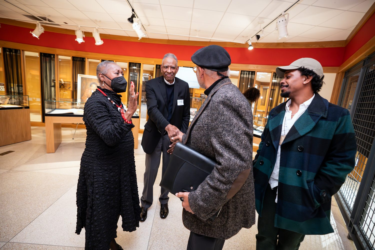 Attendees walk through "The Circle Unbroken," an exhibit celebrating the 40th anniversary of the Givens Collection. (Photo/Craig Bares)