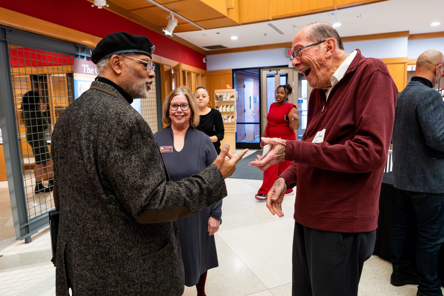 Attendees walk through "The Circle Unbroken," an exhibit celebrating the 40th anniversary of the Givens Collection. (Photo/Craig Bares)