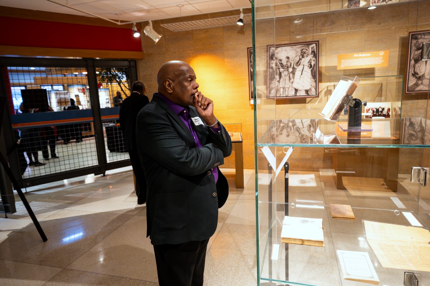 Attendees walk through "The Circle Unbroken," an exhibit celebrating the 40th anniversary of the Givens Collection. (Photo/Craig Bares)
