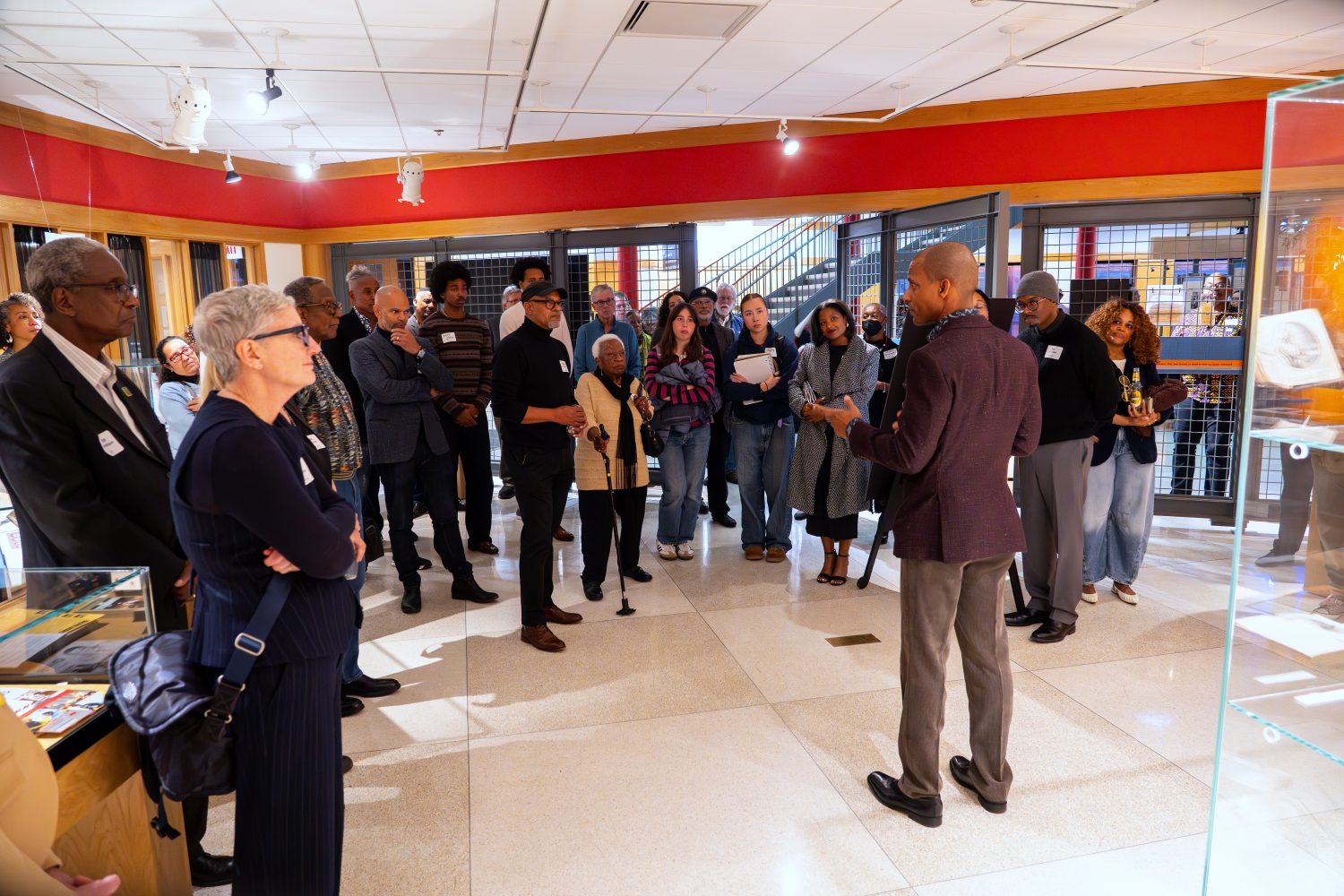Attendees walk through "The Circle Unbroken," an exhibit celebrating the 40th anniversary of the Givens Collection. (Photo/Craig Bares)