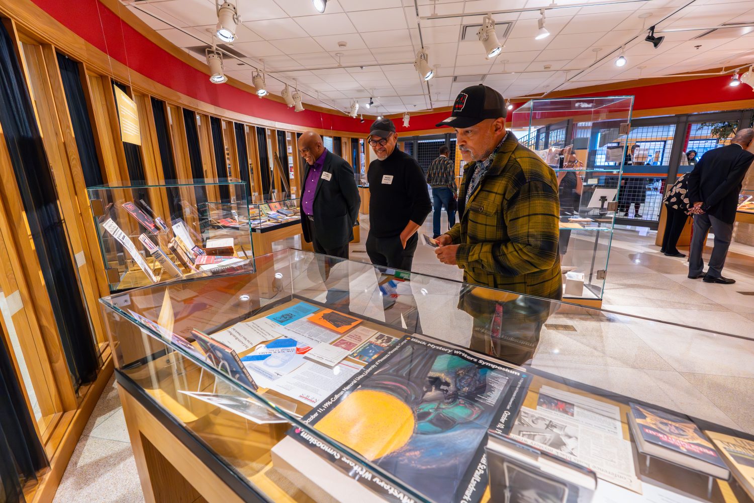 Attendees walk through "The Circle Unbroken," an exhibit celebrating the 40th anniversary of the Givens Collection. (Photo/Craig Bares)