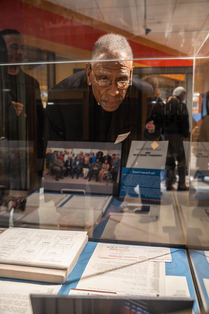 Attendees walk through "The Circle Unbroken," an exhibit celebrating the 40th anniversary of the Givens Collection. (Photo/Craig Bares)