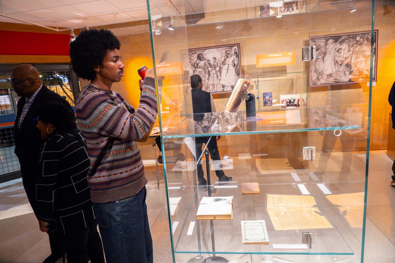 Attendees walk through "The Circle Unbroken," an exhibit celebrating the 40th anniversary of the Givens Collection. (Photo/Craig Bares)