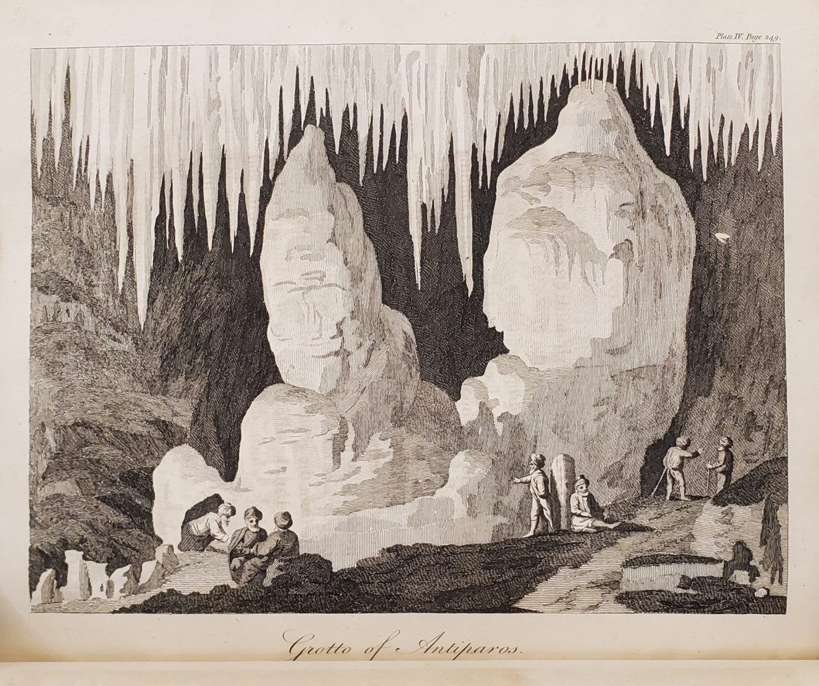 Engraved image of the interior of a cave.
